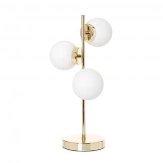Lámpara de mesa dorada con tres bolas blancas