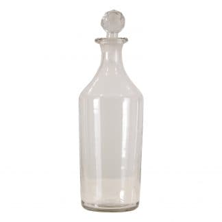 Botella decorativa cilindrica kolb, en color transparente, de estilo art deco. Fabricado en vidrio.