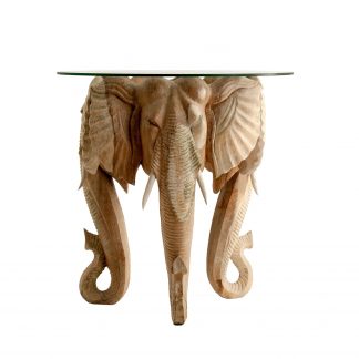 Mesa auxiliar elefante, en color natural envejecido, de estilo étnico. Fabricado en madera de teka, combinado con vidrio. Producto desmontable.