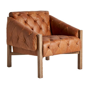Sillón Glinsk de estilo vintage fabricado en madera abedul en color marrón combinado con piel y espuma.