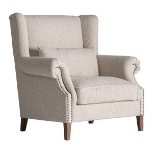 Sillón Leiston de estilo clásico, fabricado en madera de fresno en color marrón, combinado con poliéster en color crema. Producto desmontable.