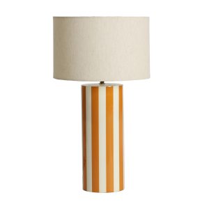 Lámpara de sobremesa Riley de estilo contemporáneo, fabricado en hierro en color ambar con acabado brillo, combinado con algodón en color beige.